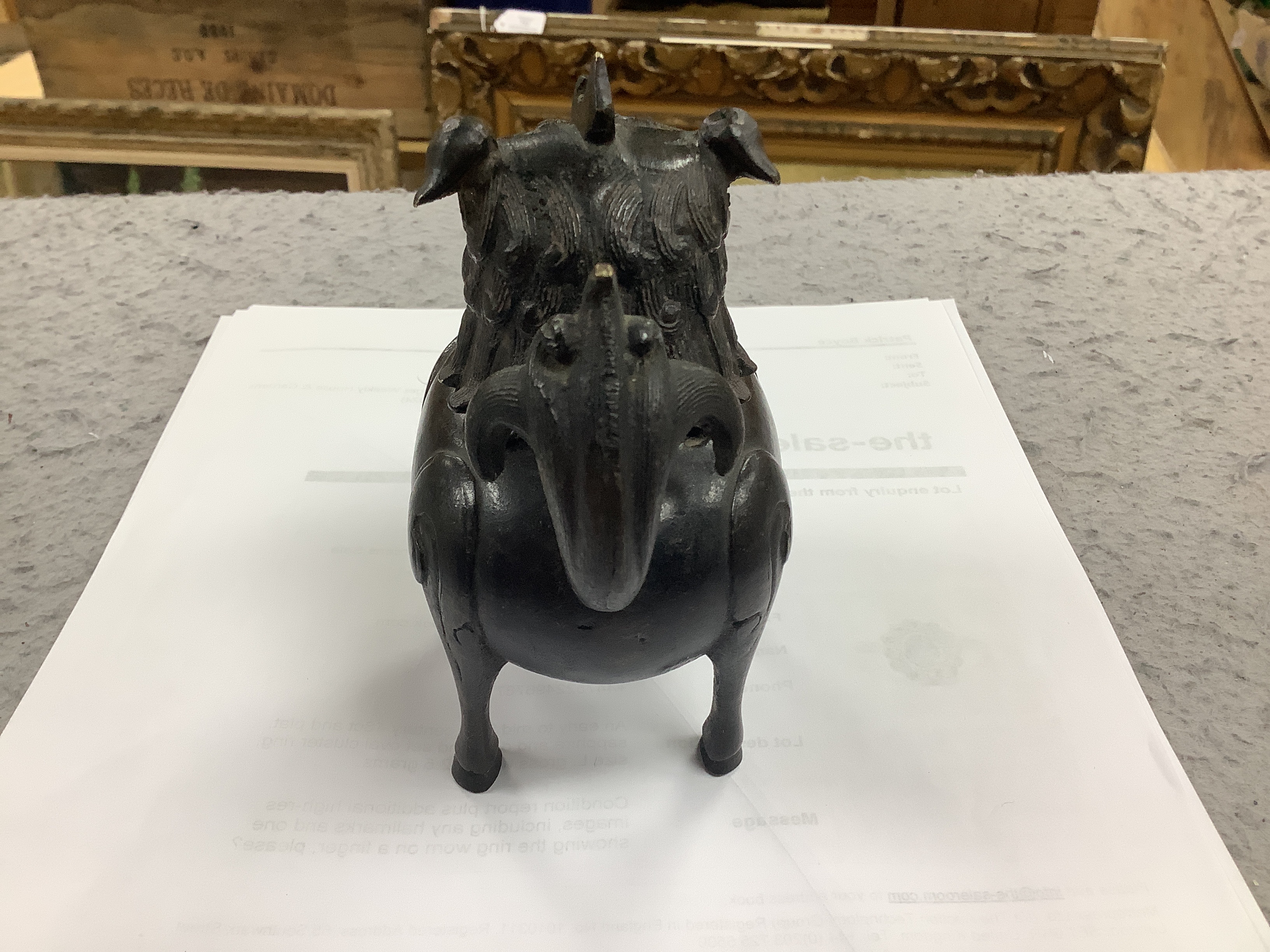 A Chinese bronze mythical beast censer and cover (Luduan), 17th century, the cover with pierced mouth, 9cm in length